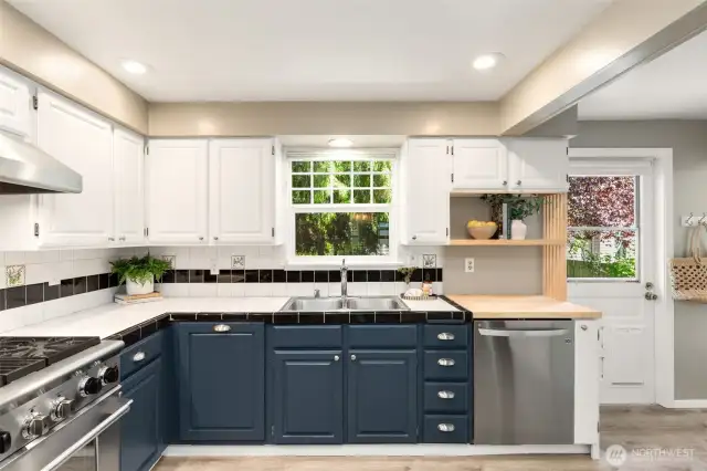 The kitchen opens to the back deck and yard - great for indoor-outdoor entertaining!