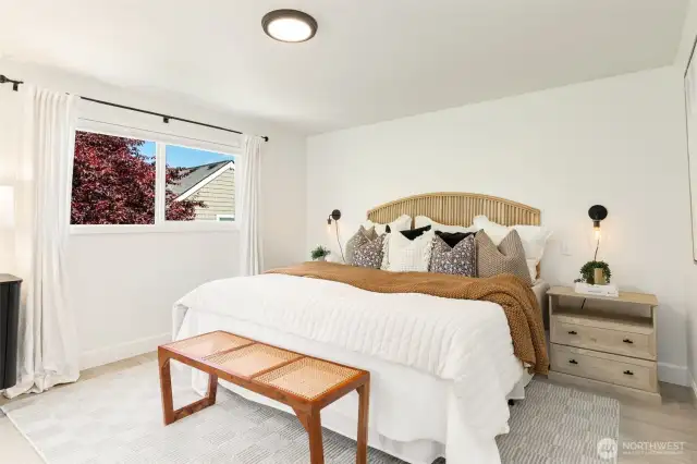 The upper floor was recently remodeled into a luxurious Primary suite.  There is plenty of space for a King size bed and the room is surrounded by windows with treetop vistas.  Very peaceful!