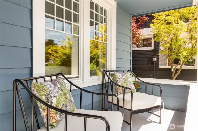 The welcoming front porch is covered for shade and protection from Seattle rain.  A perfect place to relax and greet neighbors!