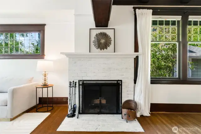 The original wood burning fireplace is white washed brick.  It is in working order, and the house comes with a supply of firewood :)