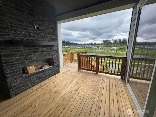 Cozy up in front of your exterior fireplace on your covered deck taking in beautiful sunset views!