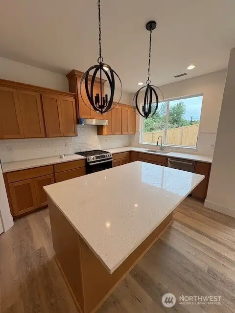 Spacious island with sink located in front of the window. Home as of 8/15/25