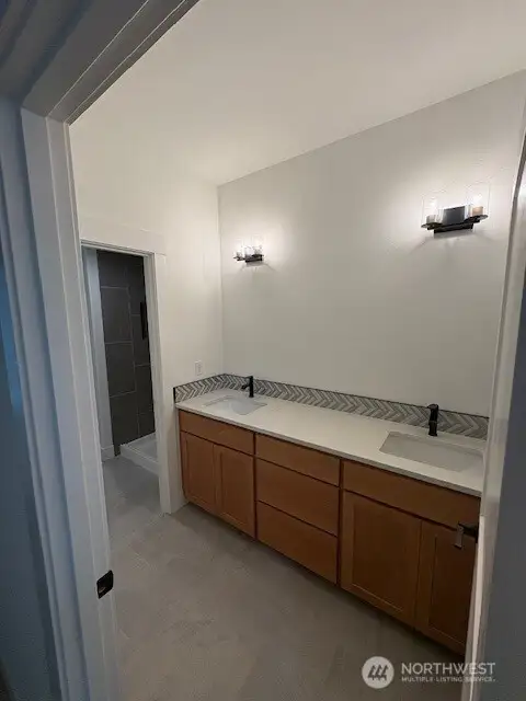 3/4 Bathroom on the main floor with dual sinks. Home as of 8/15/25