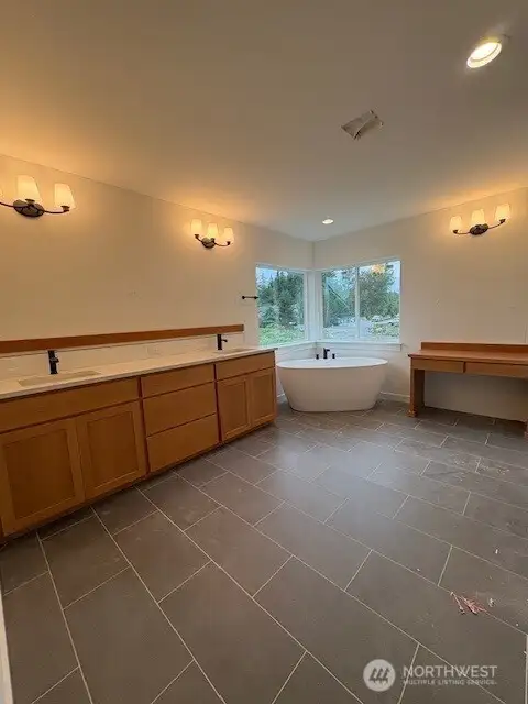 5- piece primary bathroom comolete with built-in make-up table. Home as of 8/15/25