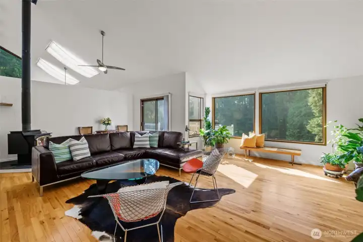 Living room has high ceilings and 2 wood burning fireplaces.