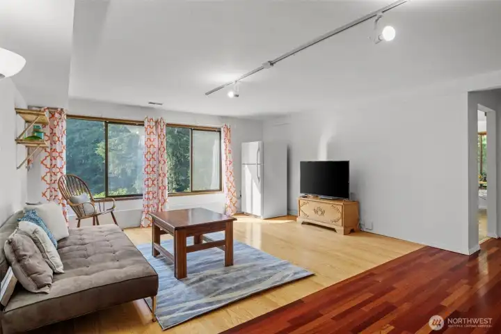 Downstairs family room with oversized windows make the area light and bright.