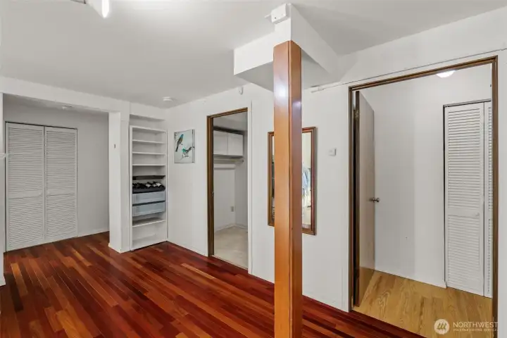 Downstairs family room area with door to extra storage room.