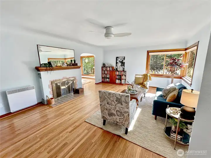 The spacious living room offers original oak floor, coved ceiling, arched doorways and beautiful Mahogany woodwork.