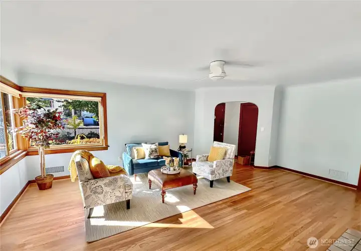 The south and west facing living room windows optimize natural light, create warmth and an inviting environment throughout the day.
