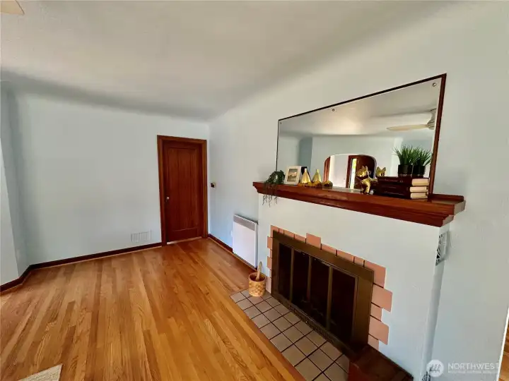 Located just off the living room is the hall (behind the closed door in this photo) that offers access to the 2 additional bedrooms and full bath.
