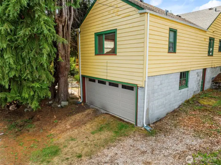 Attached two car garage with rear alley access.