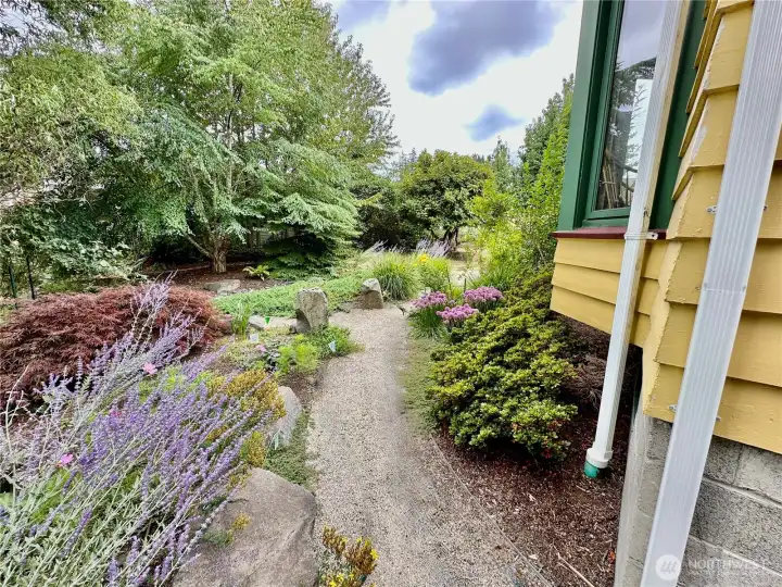 The gravel walkways with accent boulders winds through the grounds for your enjoyment.