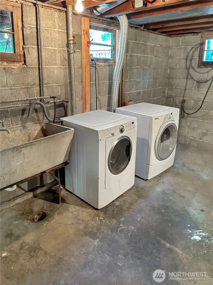 Laundry area in the full basement.  There is a large unfinished basement that is great for extra storage and projects.