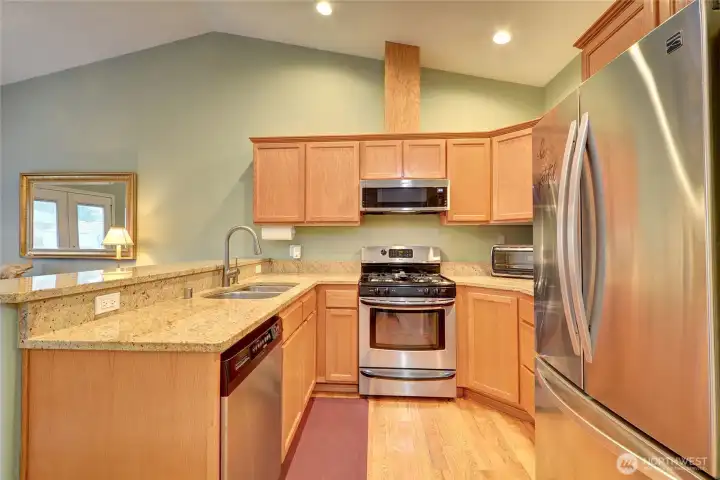 The kitchen is the perfect size with granite countertops and SS appliances.