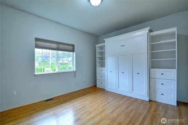 This second bedroom has a queen murphy bed which will stay in the house.