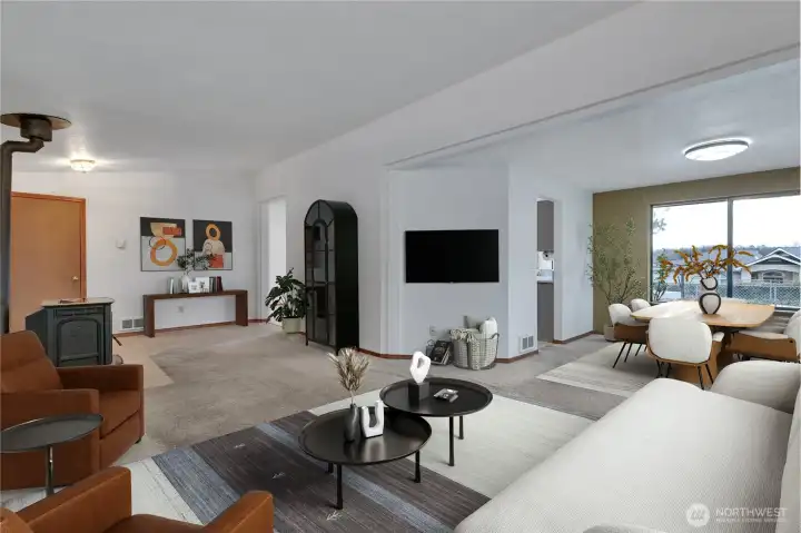 Virtually Staged Great Room with view of the virtually staged dining room.