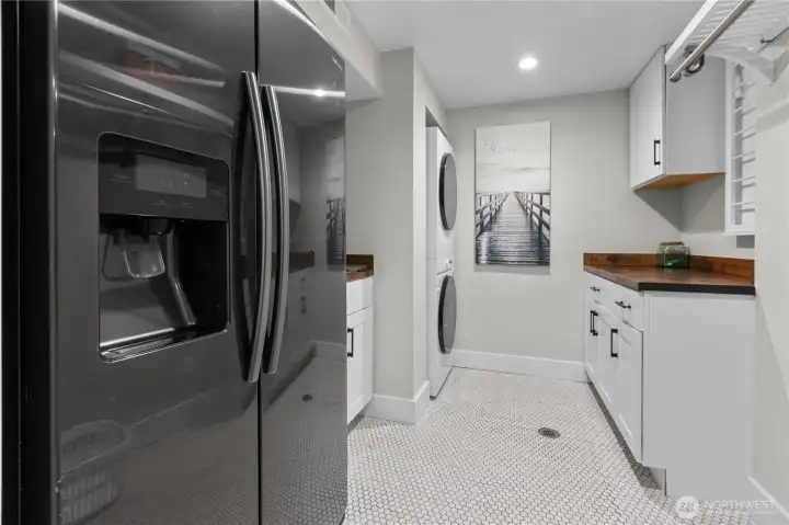 Downstairs laundry and second refrigerator