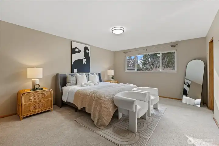 Primary bedroom with his & her closets. Main floor.