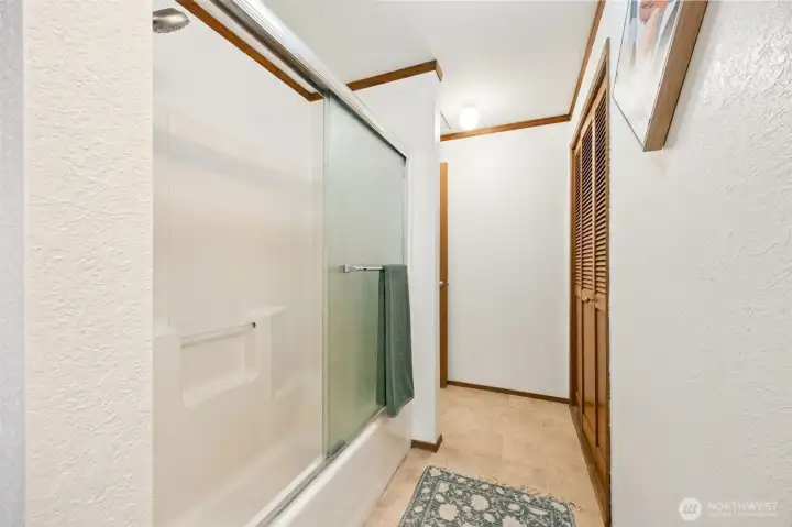 Tub & shower separating each bedroom upstairs.