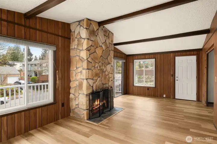 Family room with wood burning fireplace and vaulted ceilings faces southeast, allowing for plenty of natural light.