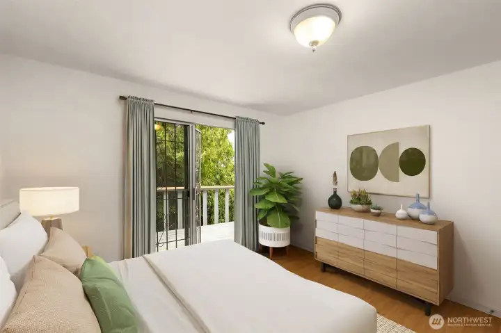 Second bedroom on upper level with entry to back upper deck. This photo is staged virtually.