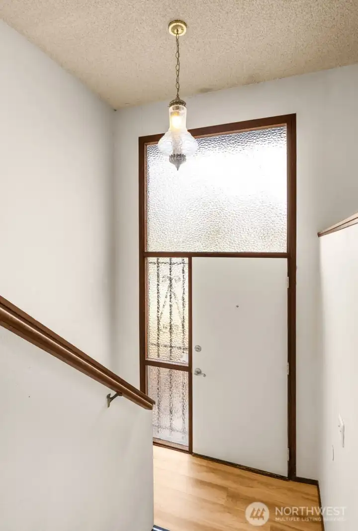 Split level entryway faces north and is in the center of the home. Allowing ease of access from the upstairs level to the downstairs level. Both levels are above grade.