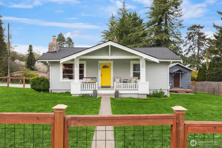 Charming craftsman curb appeal, a welcoming rocking-chair front porch, and a fully fenced approximately 9,600 sq. ft. corner lot create a first impression that feels both warm and full of possibility.