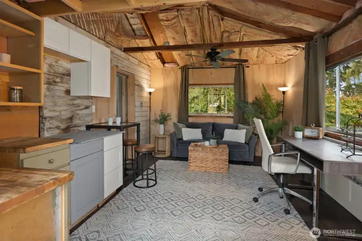 The front section of the outbuilding offers a compelling glimpse of the flexibility here — ideal for studio space, office use, hobbies, or future vision.