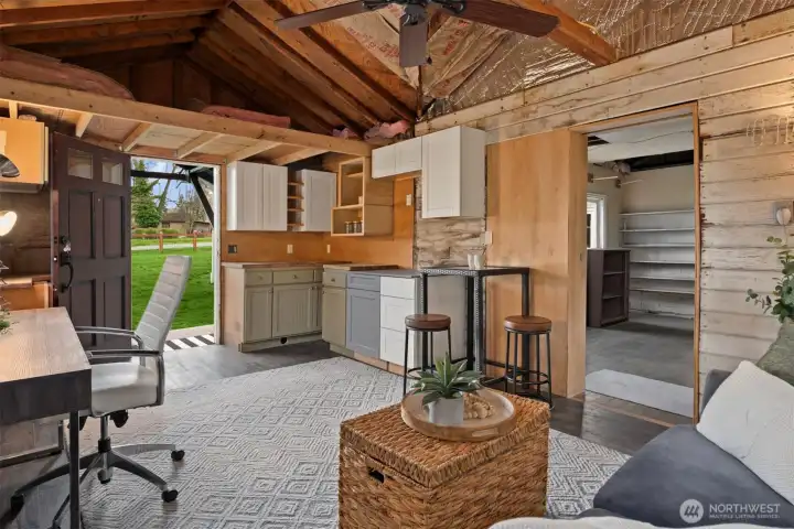 Open and full of possibility, this outbuilding space invites buyers to imagine workspace, creative use, storage, or something more.