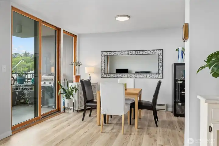 Perfectly positioned Dining Room to capture water and sunset views. It's open-concept flow is ideal for intimate dinners or larger gatherings. Effortless transition to the private outdoor deck.