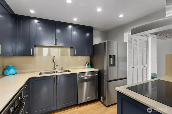 Thoughtfully designed chef’s kitchen with sleek quartz countertops.
