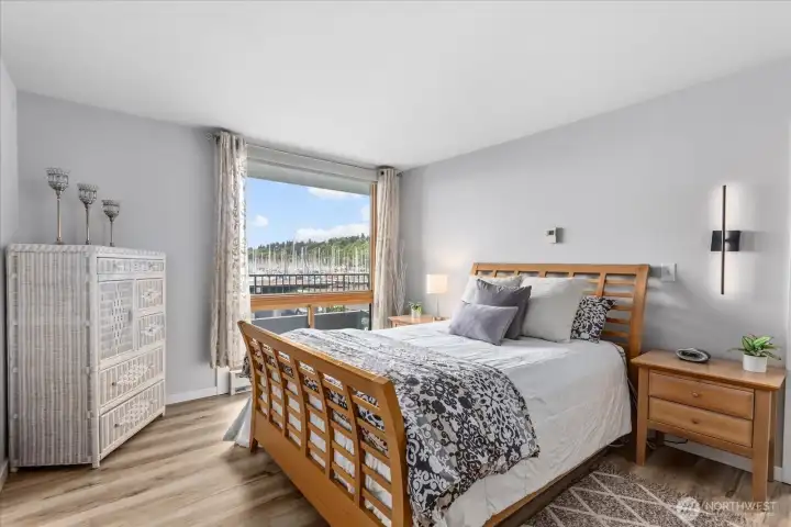 Spacious and serene retreat with a calming, coastal feel with large windows that invite soft natural light and water views.