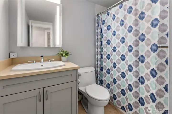 Full guest bath features clean lines and timeless finishes, designed for both functionality and comfort.