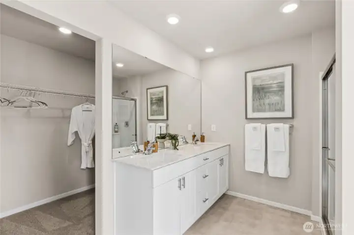 Large walk-in closet in primary bathroom. Pictures are for representation only colors and options will vary.