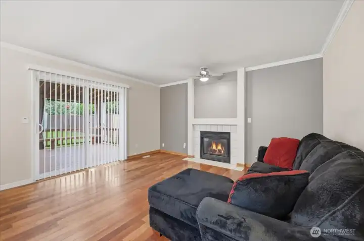Famiyroom with gas fireplace entry to backyard and more living space
