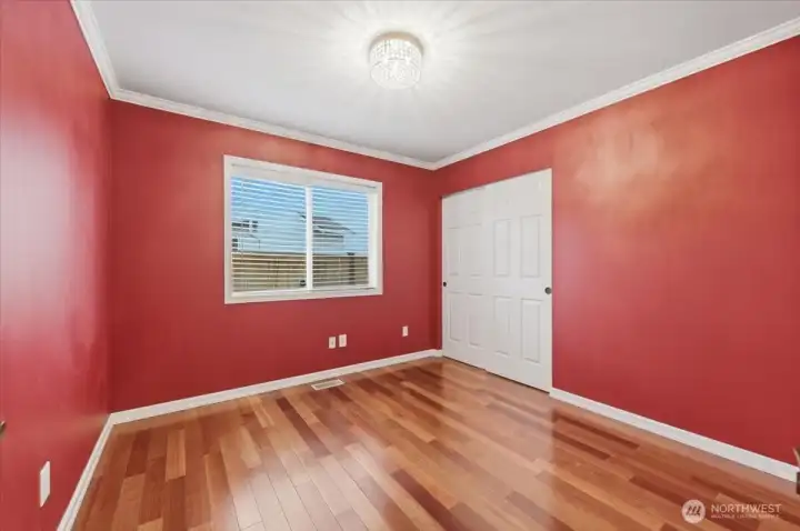 Main floor bedroom with French doors and closet for versatile uses