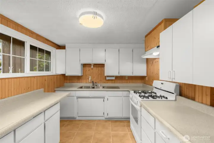 Kitchen features a gas range/oven.