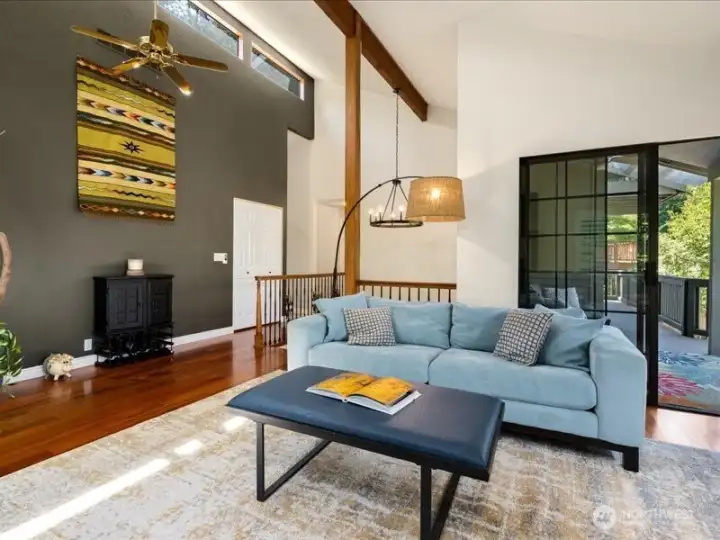Seamless living spaces bathed in natural light, and patio access Seamless living spaces bathed in natural light, and patio access