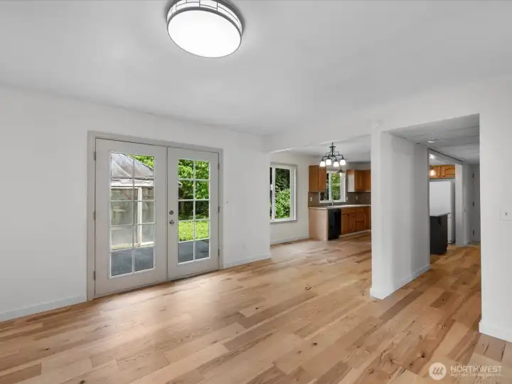 French doors lead outside to the backyard and green house.
