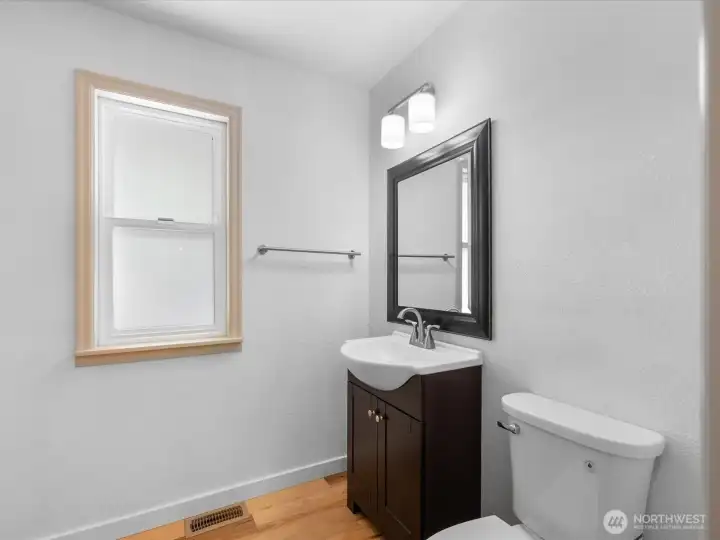 First floor bathroom with laundry.