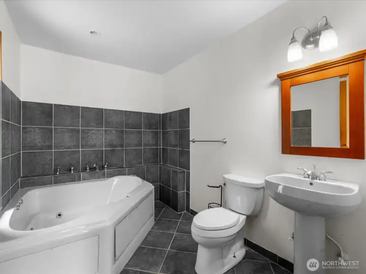 The jetted tub is perfect for soaking after a long day.