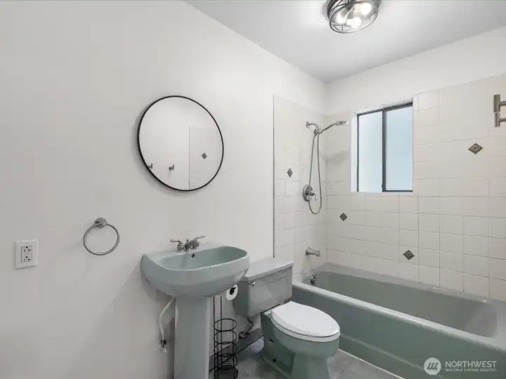 Upstairs bathroom with full shower and tub.