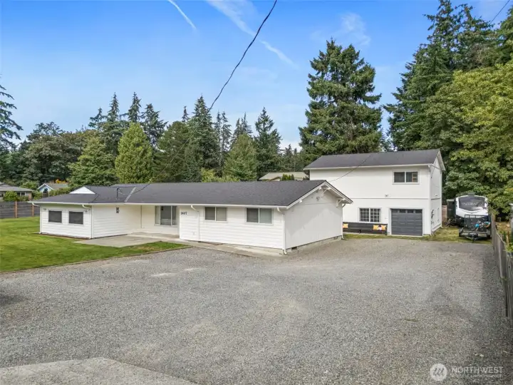 View of both homes and large driveway with RV Parking.