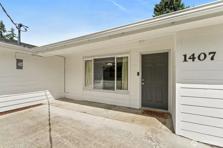 Main home front door with large front patio.
