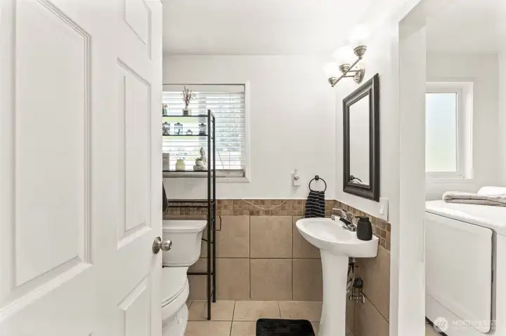 Full bathroom off of kitchen and laundry room.