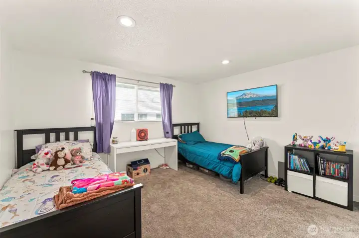 Master bedroom with door to full bathroom.