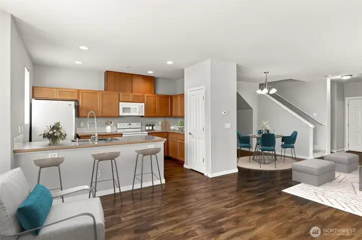 Open Concept Living / Dining / Kitchen with Natural Light, Gas Fireplace, and Hard-surface Flooring *virtually staged* Open Concept Living / Dining / Kitchen with Natural Light, Gas Fireplace, and Hard-surface Flooring *virtually staged*