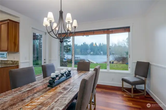 formal dining area to the right of the kithen with lakeview and backyard access door.