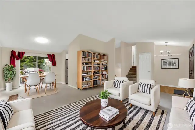 Virtually staged living room, dining room areas.