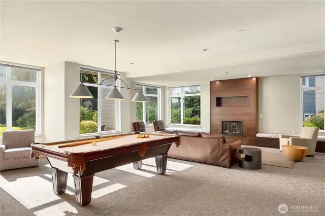 The Fireside room features a pool table, library, media room, fireplace and cozy gathering spot.